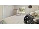 Bedroom with a view out the window, white closet and accent pillows on the bed at 165 Ne 43Rd Ave, Ocala, FL 34470