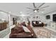 A dining area with light gray walls, hardwood floors, elegant furnishings, and a breakfast bar at 165 Ne 43Rd Ave, Ocala, FL 34470