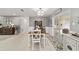 Inviting dining room showcasing natural light, light gray walls, and tile floors throughout at 165 Ne 43Rd Ave, Ocala, FL 34470