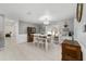 Bright dining room featuring a chandelier, sliding glass doors, and a coffee bar area at 165 Ne 43Rd Ave, Ocala, FL 34470