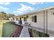 Inviting front porch features decorative plants, hanging baskets, and a cozy seating area at 165 Ne 43Rd Ave, Ocala, FL 34470