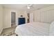 Comfortable bedroom with neutral walls, ceiling fan, and convenient access to closet and ensuite at 165 Ne 43Rd Ave, Ocala, FL 34470