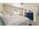 Cozy main bedroom with ceiling fan and ensuite bathroom, offering style and privacy at 165 Ne 43Rd Ave, Ocala, FL 34470