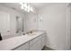 Well-lit bathroom featuring a long vanity, a large mirror, and neutral color palette at 1681 Nw 44Th Ct Rd, Ocala, FL 34482