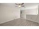 An open loft space with laminate wood flooring, a ceiling fan and natural light at 1681 Nw 44Th Ct Rd, Ocala, FL 34482