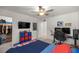 Bedroom setup for gaming and media consumption with mounted tv at 1681 Nw 44Th Ct Rd, Ocala, FL 34482