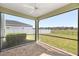 Screened porch with brick pavers offering a panoramic view of the backyard and neighborhood at 1681 Nw 44Th Ct Rd, Ocala, FL 34482