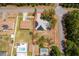 Aerial view of the property with surrounding neighborhood, highlighting solar panels and fenced yard at 18 Fir Trail Pass, Ocala, FL 34472