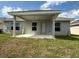 Backyard with covered patio, perfect for outdoor entertaining and relaxation at 2150 Nw 23Rd Loop, Ocala, FL 34475