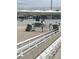 Equestrian arena with rider jumping a green and white jump surrounded by white fences and grandstand seating at 2150 Nw 23Rd Loop, Ocala, FL 34475