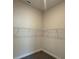Empty walk-in closet with neutral walls, wire shelving, base trim, and carpet flooring at 2150 Nw 23Rd Loop, Ocala, FL 34475