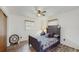 Bedroom featuring a decorative clock and a black bed frame with a floral bedspread at 21615 Sw Raintree St, Dunnellon, FL 34431