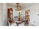 Dining room showcasing a wooden grandfather clock and stylish round table with seating at 21615 Sw Raintree St, Dunnellon, FL 34431