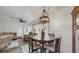 Cozy dining area featuring a round table with seating for four and a unique light fixture at 21615 Sw Raintree St, Dunnellon, FL 34431