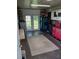 Clean garage space with double doors opening to the backyard and lots of storage at 21615 Sw Raintree St, Dunnellon, FL 34431