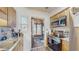 Kitchen featuring stainless steel appliances and light wood cabinets with stone countertops at 21615 Sw Raintree St, Dunnellon, FL 34431