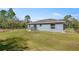 Spacious backyard with a deck and a chain link fence at 22242 Sw Marine Blvd, Dunnellon, FL 34431
