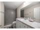 Bright bathroom featuring a tiled walk-in shower and modern vanity at 22242 Sw Marine Blvd, Dunnellon, FL 34431