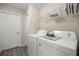Functional laundry room featuring modern white washer and dryer units at 22242 Sw Marine Blvd, Dunnellon, FL 34431