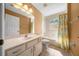 Bathroom with white vanity and shower/tub combo at 2301 Se 24Th Ave, Ocala, FL 34471