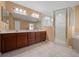 Bathroom boasts double vanity, stand-up shower, and tile floors at 2301 Se 24Th Ave, Ocala, FL 34471