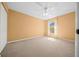 Bedroom with neutral walls, carpeting, a ceiling fan and a window at 2301 Se 24Th Ave, Ocala, FL 34471