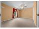 Bedroom with neutral walls and carpeting, a ceiling fan and a window at 2301 Se 24Th Ave, Ocala, FL 34471