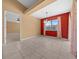 Bright dining room featuring tile flooring, neutral walls, and view into the living room at 2301 Se 24Th Ave, Ocala, FL 34471