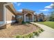 Close-up of a home's front entrance with well-maintained landscaping and a charming doorway at 2301 Se 24Th Ave, Ocala, FL 34471