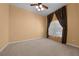 Bright, carpeted living room featuring a ceiling fan and ample natural light at 2301 Se 24Th Ave, Ocala, FL 34471