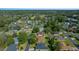 Aerial view of the residential area showcases homes with mature trees, close to wooded area at 2301 Se 24Th Ave, Ocala, FL 34471