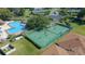 Aerial view of tennis courts alongside the community pool, offering residents recreational opportunities at 2301 Se 24Th Ave, Ocala, FL 34471