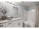 Bright bathroom features white subway tile and a granite vanity top at 328 Oak Track Run, Ocala, FL 34472