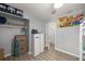 Bedroom with wood-look floors, a closet, gaming decor, and neutral walls at 3301 Se 32Nd Ave, Ocala, FL 34471