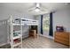 Bedroom featuring a loft bed, ceiling fan, and a view through the window to the outdoors at 3301 Se 32Nd Ave, Ocala, FL 34471