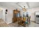 Charming dining room featuring a wooden table with seating for six, next to built-in china cabinet at 3301 Se 32Nd Ave, Ocala, FL 34471