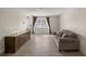 Cozy living room with neutral colors and a large window for natural light at 3301 Se 32Nd Ave, Ocala, FL 34471