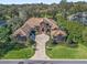 Stunning aerial view of the estate with a circular driveway, lush landscaping, and a grand entrance at 3848 Nw 85Th Ter, Ocala, FL 34482