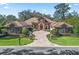 Beautiful front exterior with paver driveway and stone accents with manicured landscaping offering great curb appeal at 3848 Nw 85Th Ter, Ocala, FL 34482