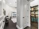 Hallway leading to the living area and walk-in closet, showcasing the home's open layout and design at 3848 Nw 85Th Ter, Ocala, FL 34482