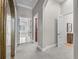 Hallway with neutral tones, arched doorways and access to other rooms in the home at 3848 Nw 85Th Ter, Ocala, FL 34482