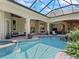 Relaxing pool and patio area with lush landscaping and plenty of seating at 3848 Nw 85Th Ter, Ocala, FL 34482