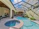 This luxurious pool features a spa and a waterfall at 3848 Nw 85Th Ter, Ocala, FL 34482