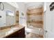 Neutral toned bathroom with dark wood vanity and glass enclosed shower at 4103 Se 10Th Ave, Ocala, FL 34480