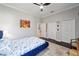 Bright, spacious bedroom with blue accents and hardwood floors at 4103 Se 10Th Ave, Ocala, FL 34480