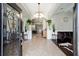 Grand foyer with tile flooring, arched doorways, elegant lighting, and views into the living spaces at 4103 Se 10Th Ave, Ocala, FL 34480