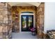 Elegant front entrance featuring a double door, stone accents, and a welcoming porch at 4103 Se 10Th Ave, Ocala, FL 34480
