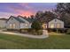 Charming single-story home with stone accents, manicured lawn, and inviting walkway at 4103 Se 10Th Ave, Ocala, FL 34480