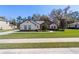 Lovely single-Gathering house with a stone facade, lush green lawn, and mature landscaping at 4103 Se 10Th Ave, Ocala, FL 34480