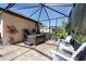 Screened-in lanai with hot tub and comfortable seating; a perfect relaxation retreat at 4103 Se 10Th Ave, Ocala, FL 34480